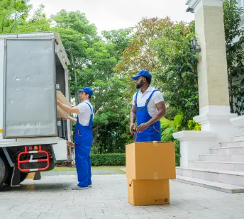 movers in front of house