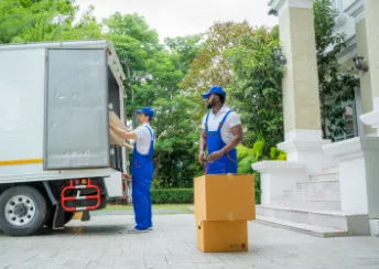 movers sitting on edge of truck