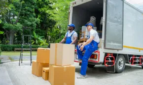 movers sittin on edge of truck